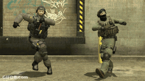 Two Soldiers Dancing In Front Of Brick Wall One With Police GIF