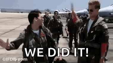 Two Soldiers High-Fiving On Runway GIF