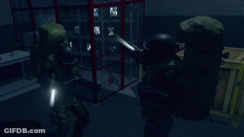 Two Soldiers Holding Guns In A Dark Room With A Red Cage In The Background GIF
