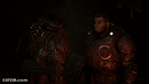 Two Soldiers In Armor Are Standing Next To Each Other In The Dark GIF