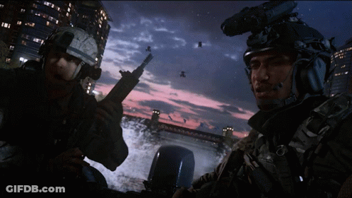 Two Soldiers Standing By Bridge At Night GIF