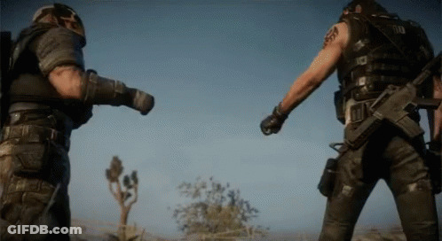 Two Soldiers Standing Next To Each Other One With Arm Tattoo Saying A GIF