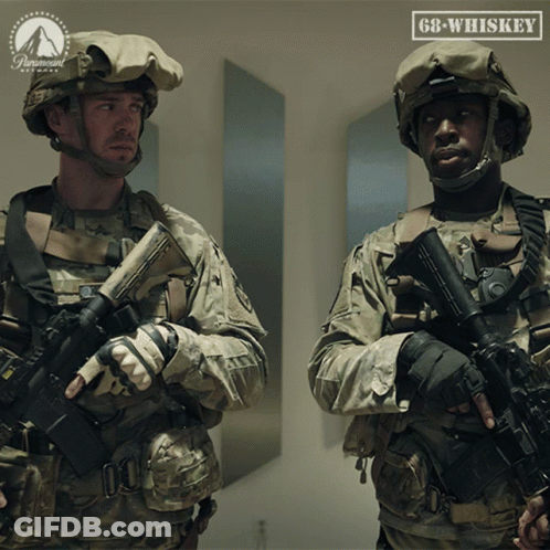 Two Soldiers Standing Next To Paramount Logo GIF