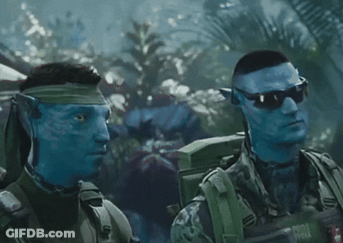 Two Soldiers With Blue Faces Are Standing Next To Each Other And One Has A Backpack That Says ' Army ' On It GIF