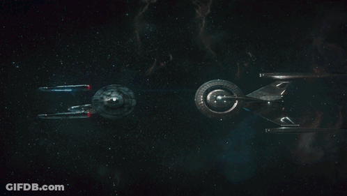 Two Spaceships Flying In Dark GIF