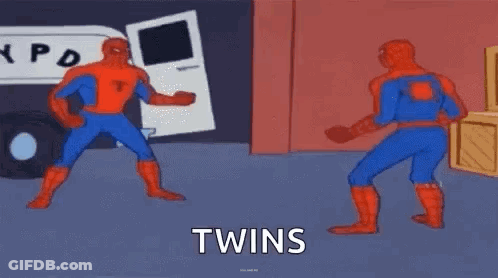 Two Spider-Man Are Standing Next To Each Other In A Room And Fighting . GIF
