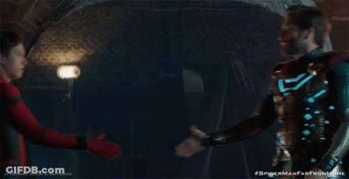 Two Spider Man Characters Shaking Hands In A Scene From Spider Man Far From Home GIF