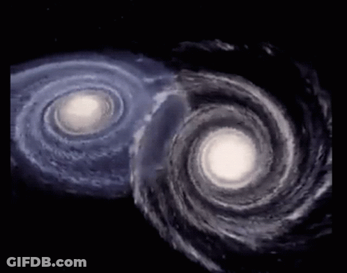 Two Spiral Galaxies Moving In Opposite Directions GIF