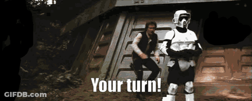 Two Stormtroopers Are Standing Next To Each Other With The Words " Your Turn " Written Below Them GIF