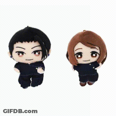 Two Stuffed Animals , A Boy And A Girl , Are Sitting Next To Each Other On A White Background . GIF