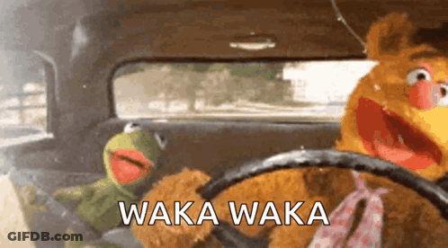 Two Stuffed Animals Are Driving In A Car And The Words Waka Waka Are Visible GIF