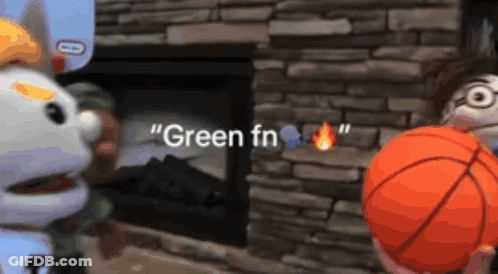 Two Stuffed Animals Are Playing With A Basketball In Front Of A Fireplace That Says " Green Fn " On It GIF