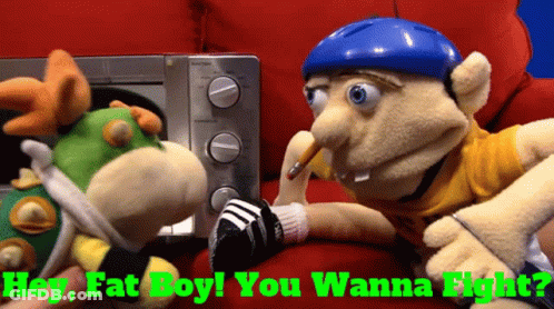 Two Stuffed Animals Are Sitting Next To Each Other With The Words " Hey Fat Boy You Wanna Fight " On The Bottom GIF