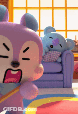 Two Stuffed Animals Are Sitting On A Couch And One Is Sleeping GIF