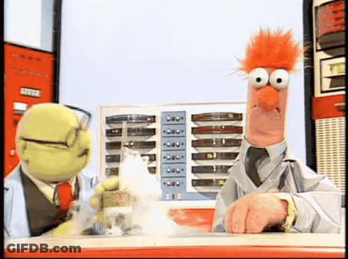 Two Stuffed Animals Are Standing Next To Each Other And One Of Them Has A Red Haired Face GIF