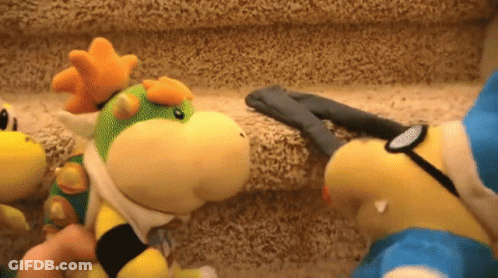 Two Stuffed Animals Are Standing Next To Each Other On A Staircase GIF
