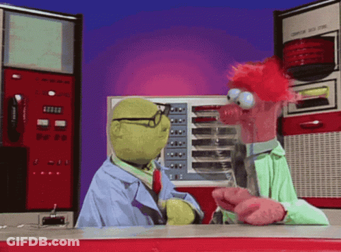 Two Stuffed Animals Are Talking In Front Of A Machine That Says Computer On The Front GIF