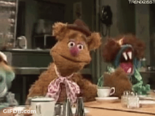 Two Stuffed Animals At Table With Coffee GIF