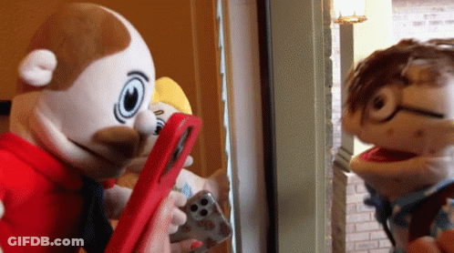 Two Stuffed Animals Looking At Phone GIF