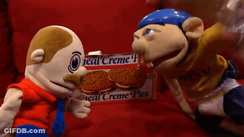 Two Stuffed Animals Next To Box Of Creme Pies GIF