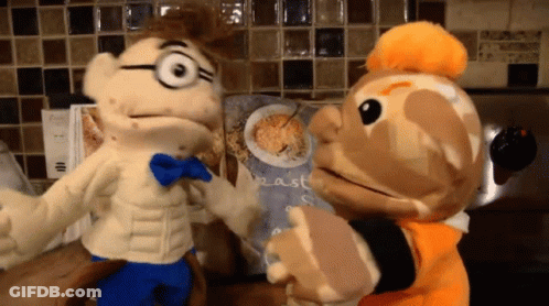 Two Stuffed Animals Next To Oatmeal Cereal Bag GIF