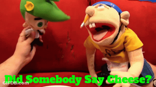 Two Stuffed Animals On Red Couch Did Somebody Say Cheese GIF