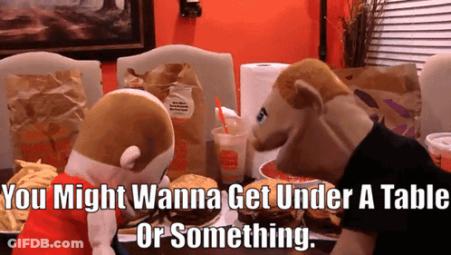 Two Stuffed Animals Saying You Might Wanna Get Under A Table GIF