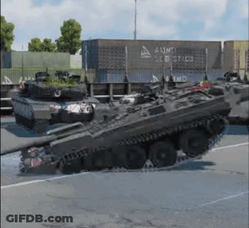 Two Tanks In Front Of AUMG Logistics GIF