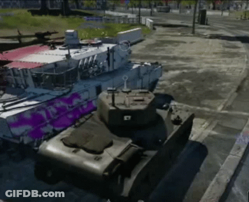 Two Tanks Parked Side By Side With Purple Paint GIF