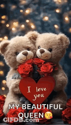 Two Teddy Bears Are Hugging Each Other And Holding A Red Heart . GIF