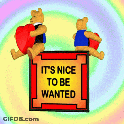 Two Teddy Bears Holding Hearts Saying It's Nice To Be Wanted GIF