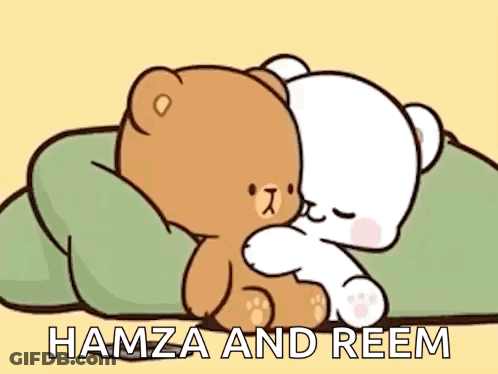 Two Teddy Bears Hugging On A Bed GIF