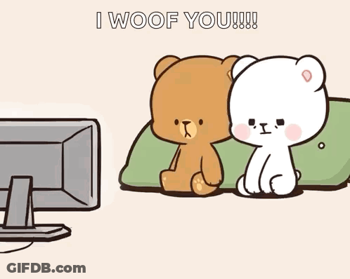 Two Teddy Bears Sitting In Front Of Television GIF