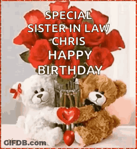 Two Teddy Bears Sitting Next To Vase Of Red Roses And Heart GIF
