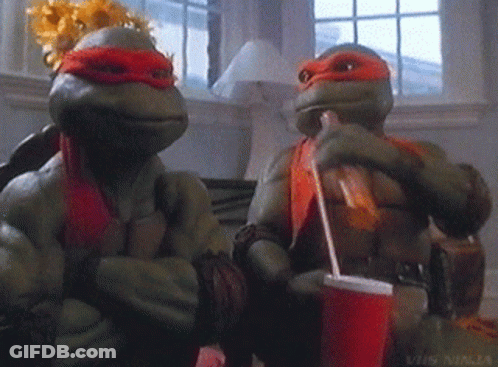 Two Teenage Mutant Ninja Turtles Sitting Next To Each Other Drinking Soda GIF