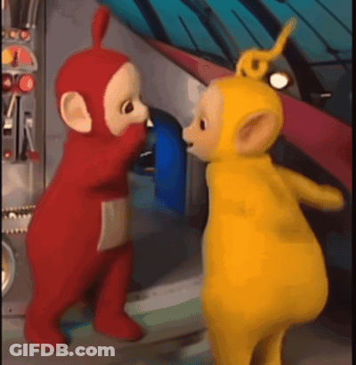 Two Teletubbies Standing In A Room GIF