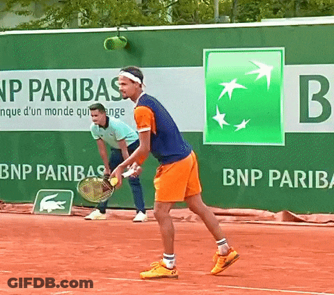 Two Tennis Players On A Court With A Bnp Paribas Banner Behind Them GIF