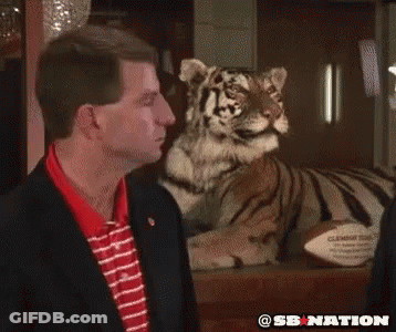 Two Texas A&M Football Players Talking On Field GIF