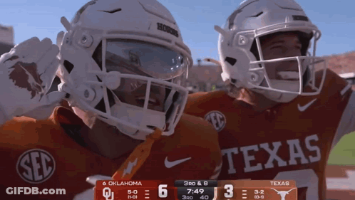 Two Texas Football Players Celebrating Score GIF