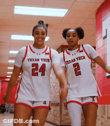 Two Texas Tech Female Basketball Players Walking Down Hallway GIF