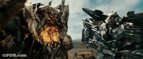 Two Transformers Fighting In Movie Scene GIF