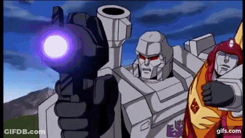 Two Transformers One Pointing Gun At Camera GIF