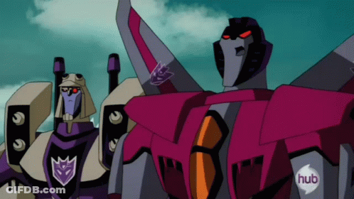 Two Transformers Standing With Hub Logo On Chests GIF