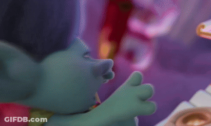 Two Trolls Are Standing Next To Each Other And One Has A Crown On His Head GIF