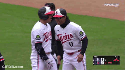 Two Twins Baseball Players Talking On The Field GIF