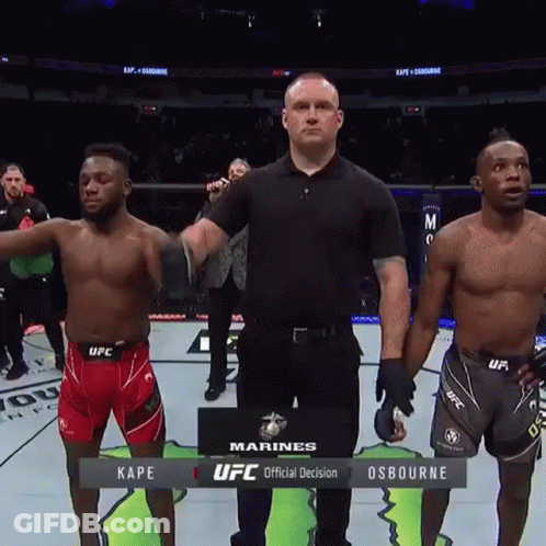 Two Ufc Fighters Are Standing Next To Each Other On The Ring GIF