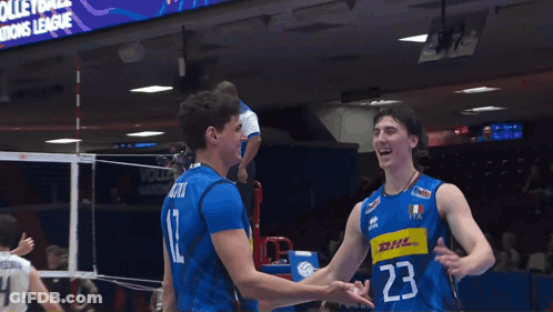 Two Volleyball Players With Number 23 GIF