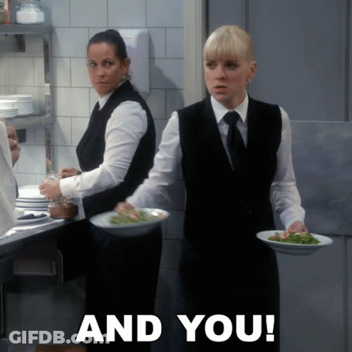 Two Waitresses Carrying Plates Of Food GIF