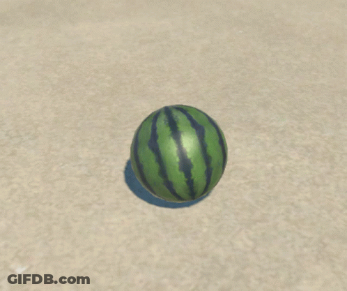 Two Watermelons Cut In Half On Sand GIF