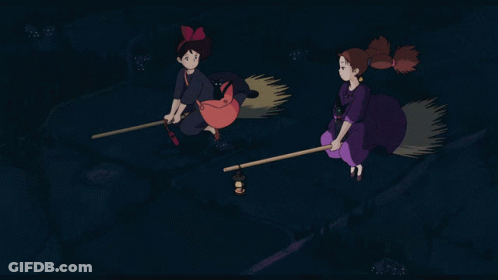 Two Witches Flying On Brooms In Night Sky GIF